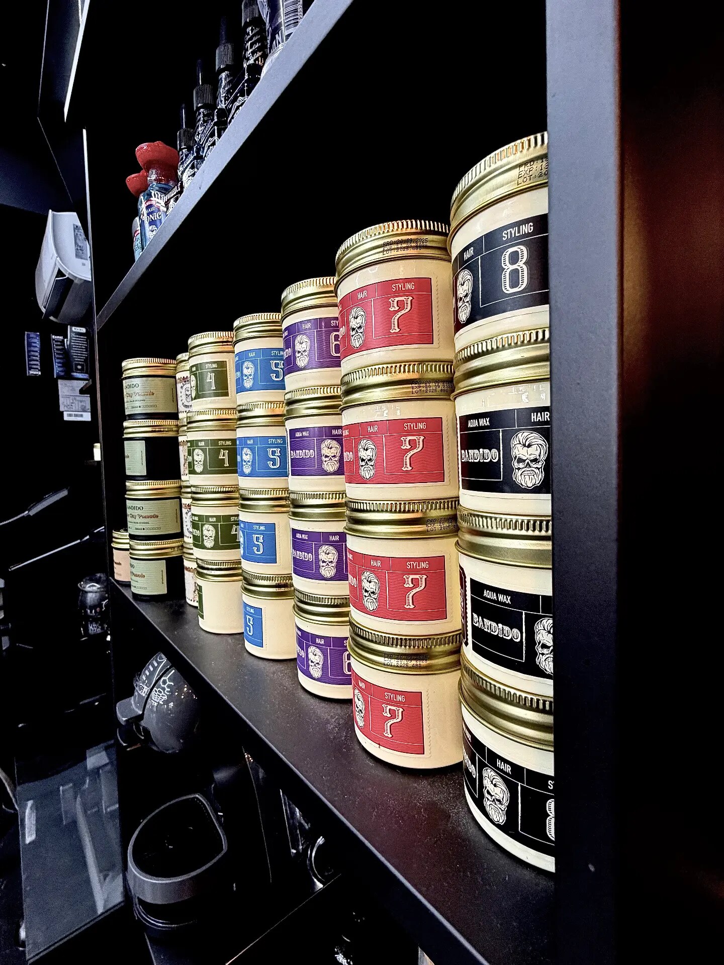 Shelf with styling pomades and waxes